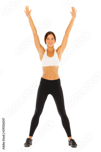 Young healthy girl doing exercises, full length portrait isolated over white background © Andrey_Arkusha