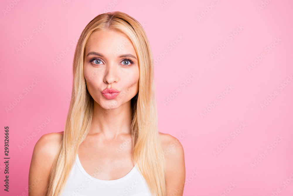 Closeup photo of amazing millennial lady sending air kisses to handsome guy using nude mate lipstick wear white tank-top isolated on pink color background Closeup photo of amazing millennial lady sending air kisses to handsome guy using nude mate lipstick wear white tank-top isolated on pink color background