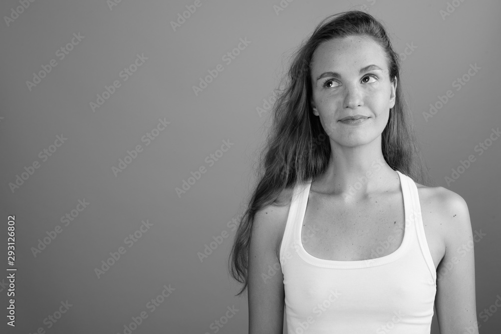 Young beautiful woman thinking and looking up shot in black and white Young beautiful woman thinking and looking up shot in black and white