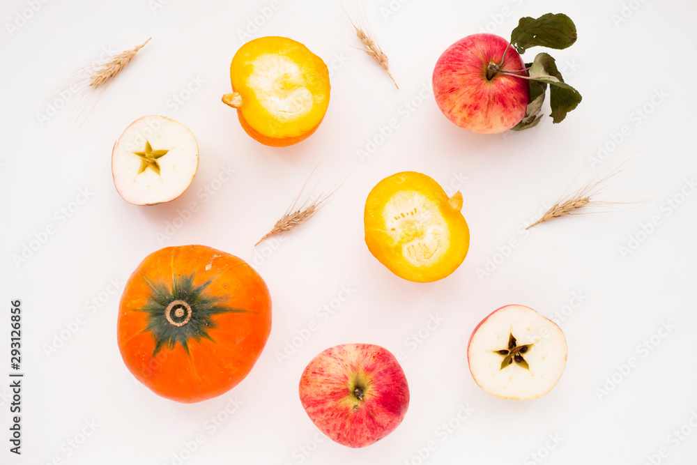 Fresh sliced pumpkin(squash), apples, glass jar of honey isolated on white background. Food, Thanksgiving day concept. Top view. Space for a text. Flat lay. Close up. Fresh sliced pumpkin(squash), apples, glass jar of honey isolated on white background. Food, Thanksgiving day concept. Top view. Space for a text. Flat lay. Close up.