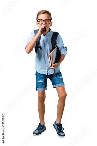 Full body of Student boy with backpack and glasses shouting with mouth wide open on isolated white background