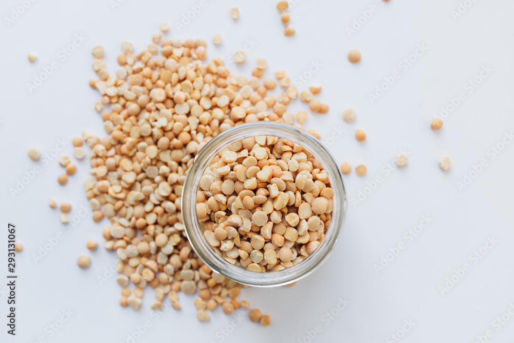 Glass jar with raw dry peas, macro Glass jar with raw dry peas, macro