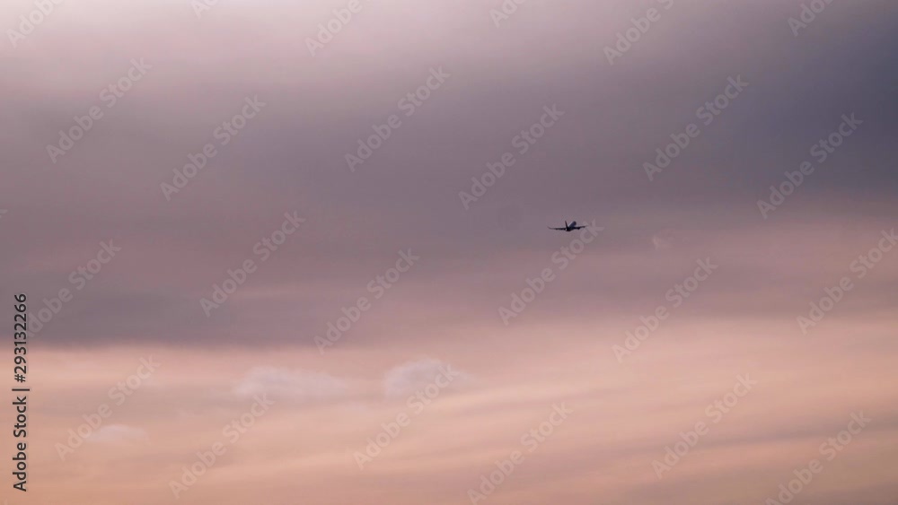 Airplane is flying in sunset sky. Air transport, transportation concept Airplane is flying in sunset sky. Air transport, transportation concept