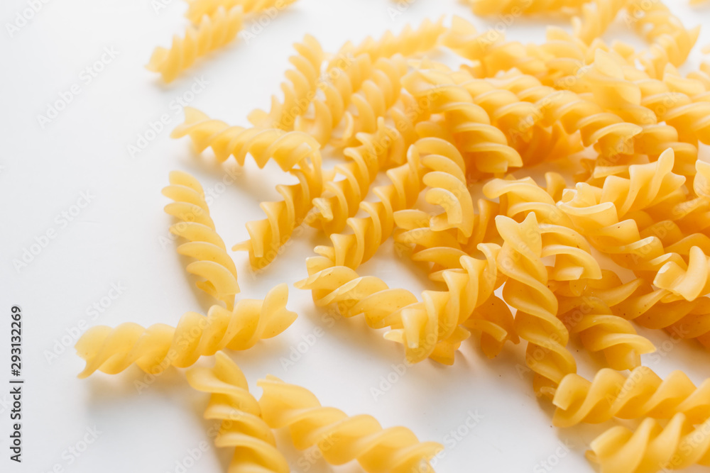 Pile of uncooked macaroni on white background Pile of uncooked macaroni on white background