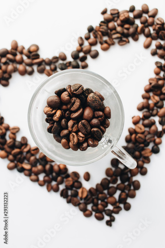 Close-up view of roasted coffee beans, pile in shape of heart 