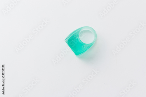 Modern style plastic ring on grey background