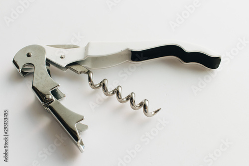 Metal corkscrew on white background