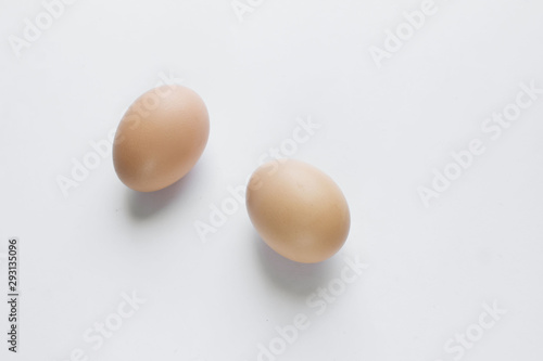 Chicken eggs in cardboard package on white background