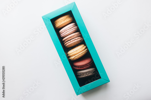 Box with delicious bright macaroons, sweet dessert © Ann