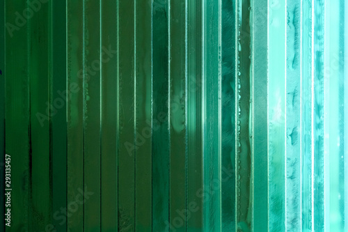 Green thick glass background. Abstract background, glass texture.
