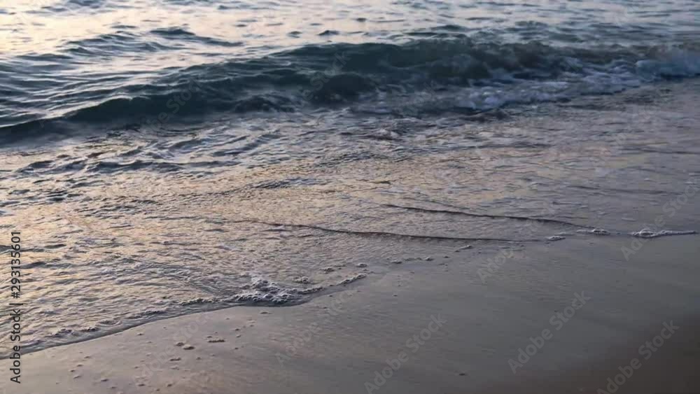 Wave of the sea or ocean in the calm on the sandy coast. Watching the waves Wave of the sea or ocean in the calm on the sandy coast. Watching the waves