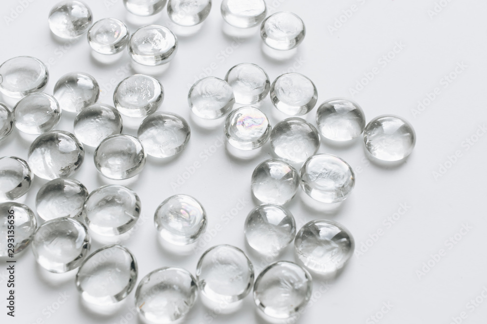 Scattered crystals on white background, beautiful gems Scattered crystals on white background, beautiful gems