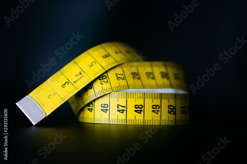measuring tape isolated on black background