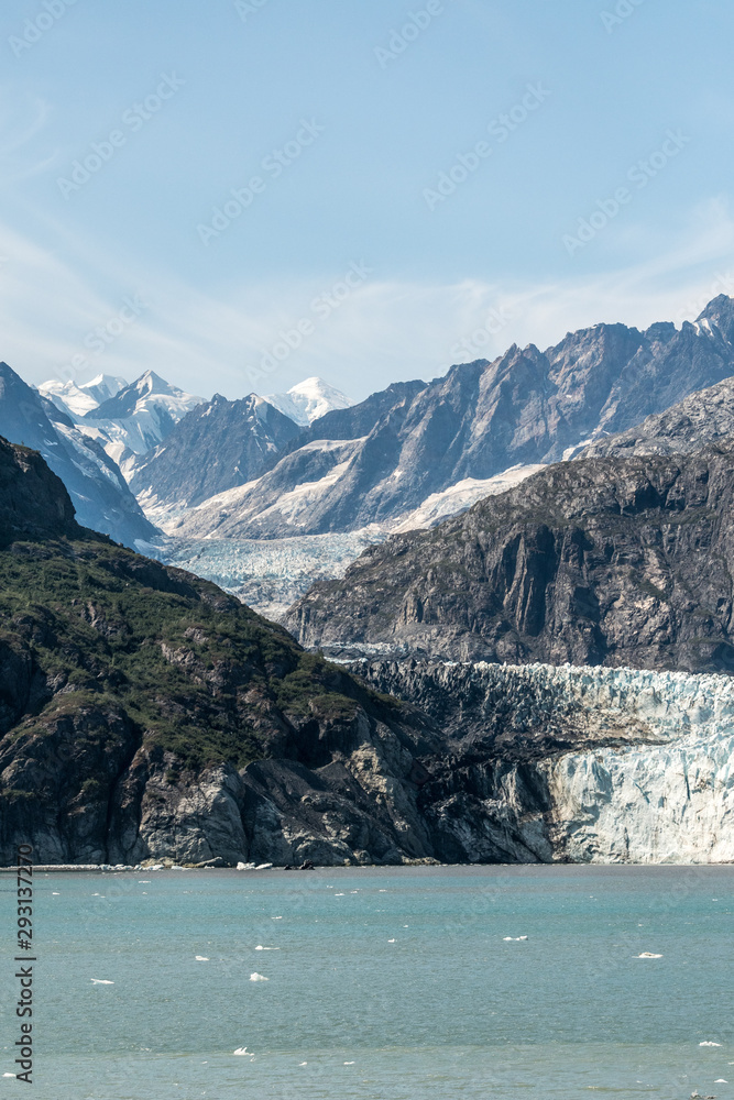 receding Hubbard Glacier in Alaska in Portrait  with copy space