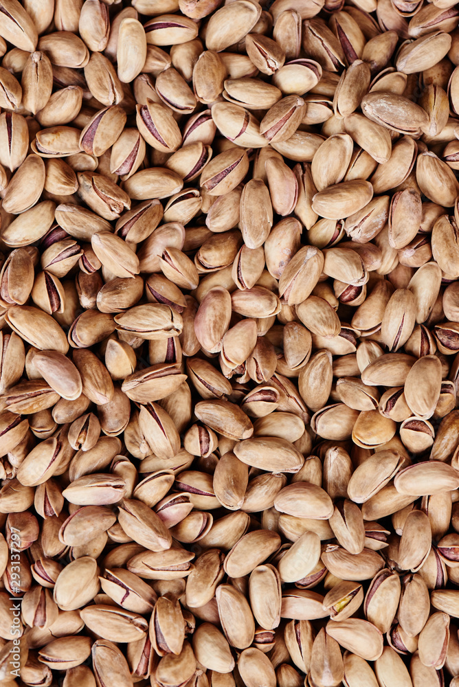 Background of inshell pistachios nuts closeup Background of inshell pistachios nuts closeup
