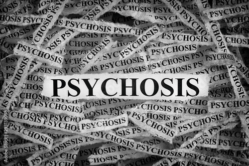 Torn pieces of paper with the word Psychosis