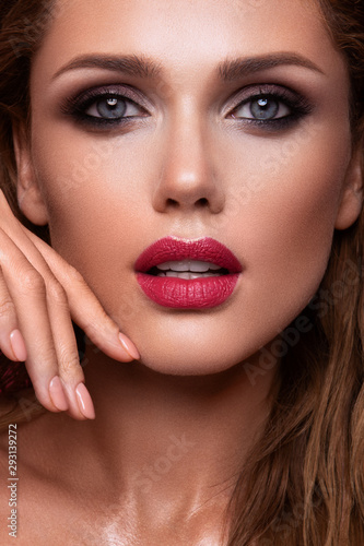 Portrait of beautiful girl with pink lips