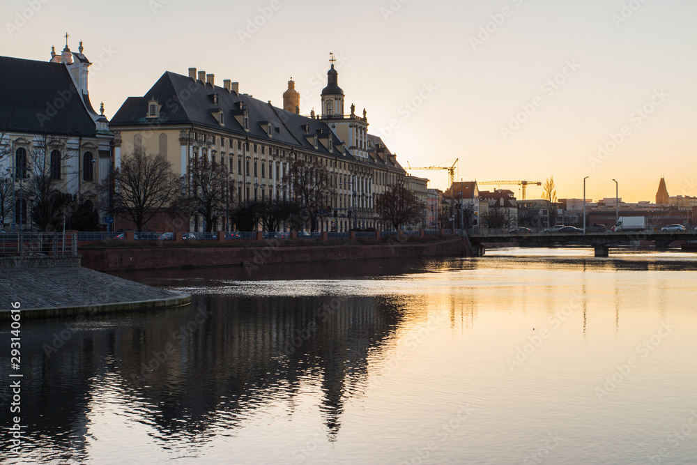 View of the river embankment in the city of Wroclaw at sunset. Poland