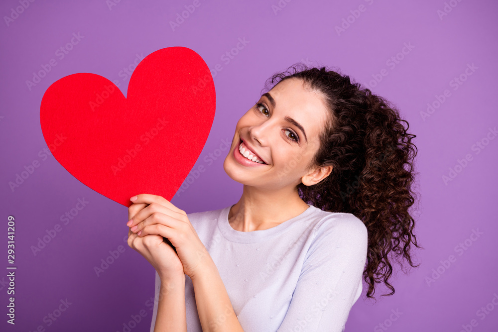 Photo of white cheerful cute nice lovely girlish feminine youngster holding valentine postcard red heart big smiling toothily trendy isolated over violet pastel color background