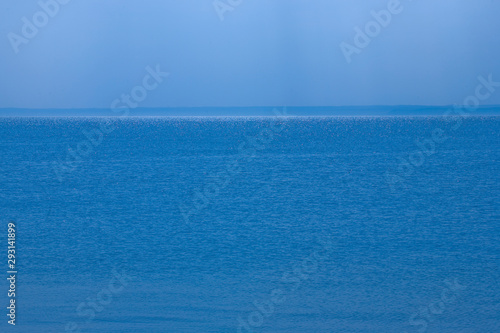  calm blue sea landscape with cloudless sky and water