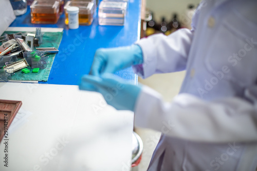 Staff are wearing gloves to work in the operating room in the hospital,select focus.