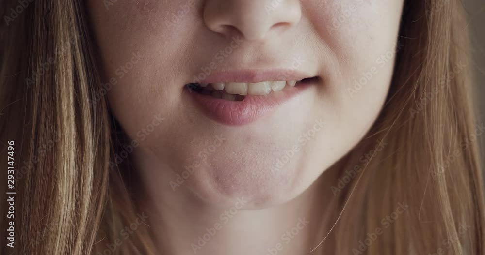 Girl bites lips and smiling with beautiful soft lips. Girl bites lips and smiling with beautiful soft lips.