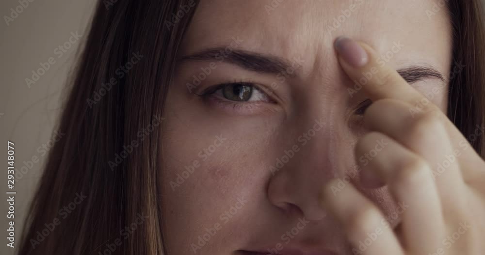 Beautiful young woman touches her face. Beautiful young woman touches her face.