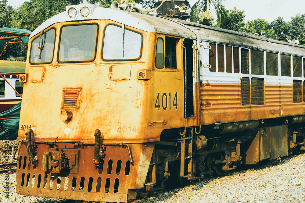 Yellow train, Thailand train. Procession yellow Train led by diesel electric locomotive on the tracks from Thailand