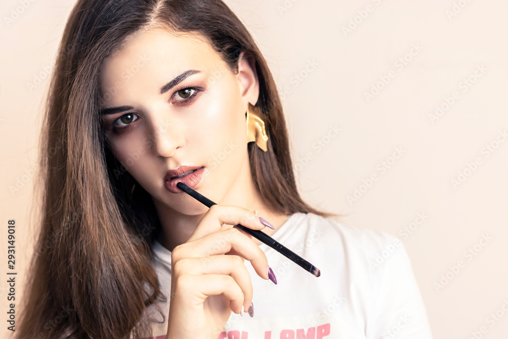 beautiful girl on white background. Girl holding pen for notes, glasses. The concept of beauty services, botox, skin care, modern fashion, blog, notes beautiful girl on white background. Girl holding pen for notes, glasses. The concept of beauty services, botox, skin care, modern fashion, blog, notes