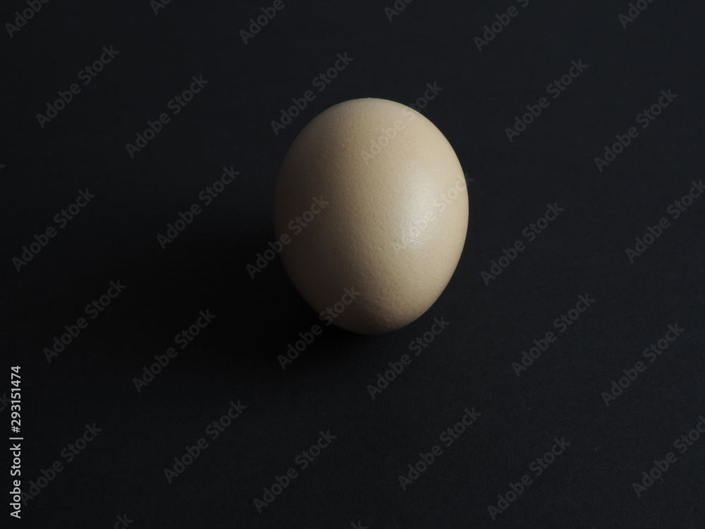 natural fresh chicken egg on black paper background natural fresh chicken egg on black paper background