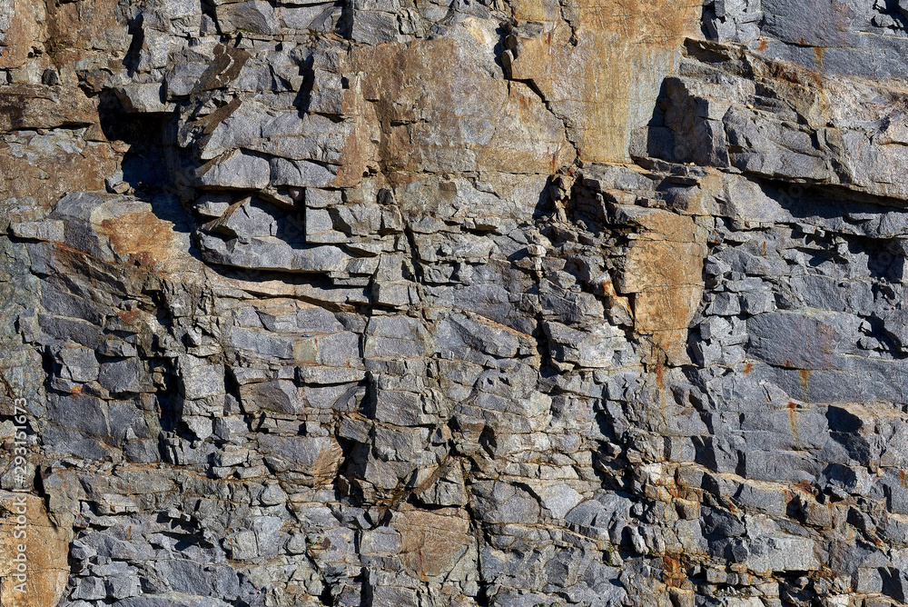 Obraz premium Rocks carved by sea water erosion. Stones texture and background. Rock texture