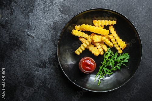 french fries and sauce (delicious snack, fast food, deep fried potatoes) menu concept. food background. copy space. Top view