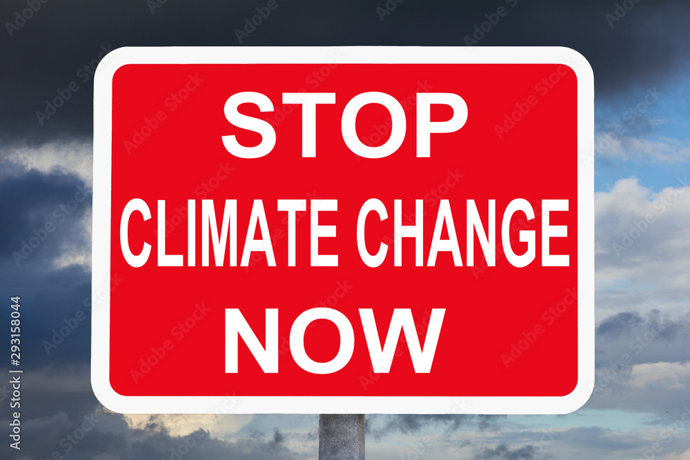 Climate change concept: STOP CLIMATE CHANGE NOW text on red and white warning sign in front of dark sky. Climate change concept: STOP CLIMATE CHANGE NOW text on red and white warning sign in front of dark sky.