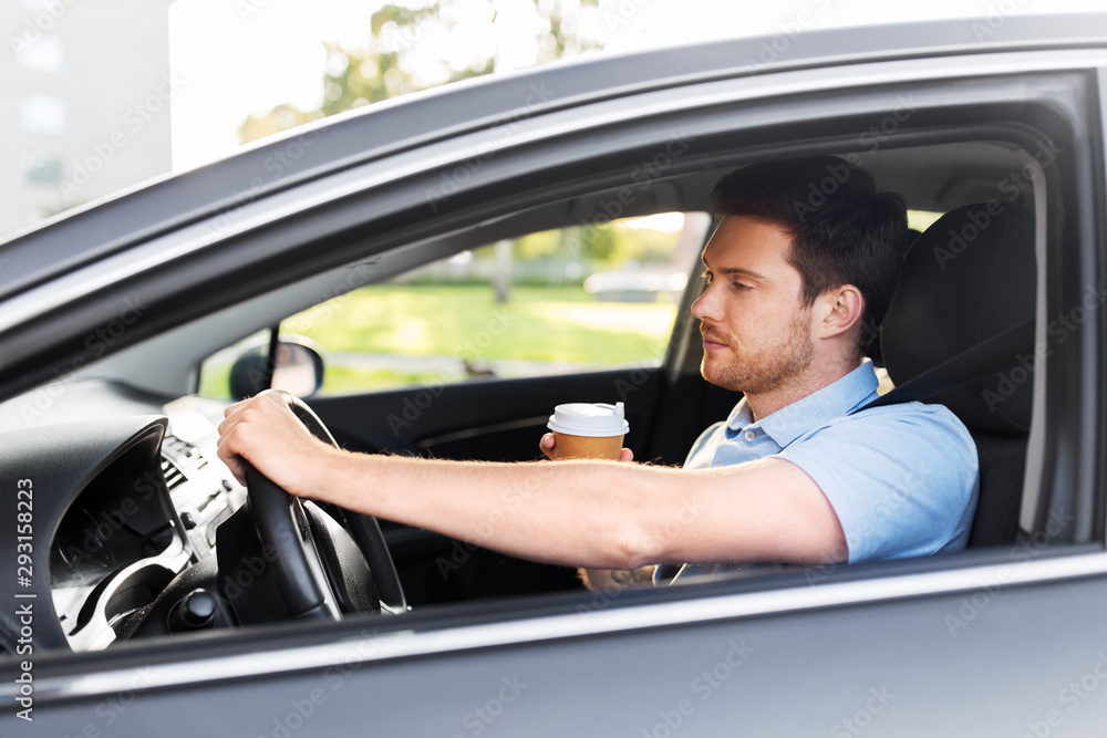 transport, vehicle and driving concept - tired sleepy man or car driver with takeaway coffee cup