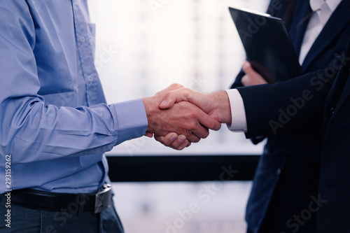 Business handshake after completed deal and business agreement.     © Asada