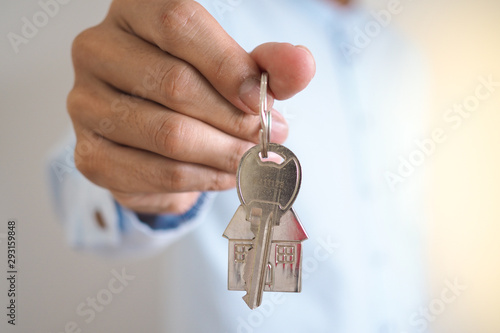 Landlord unlocks the house key for new home