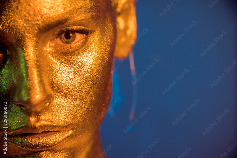 beauty fashion model girl with golden makeup gold skin