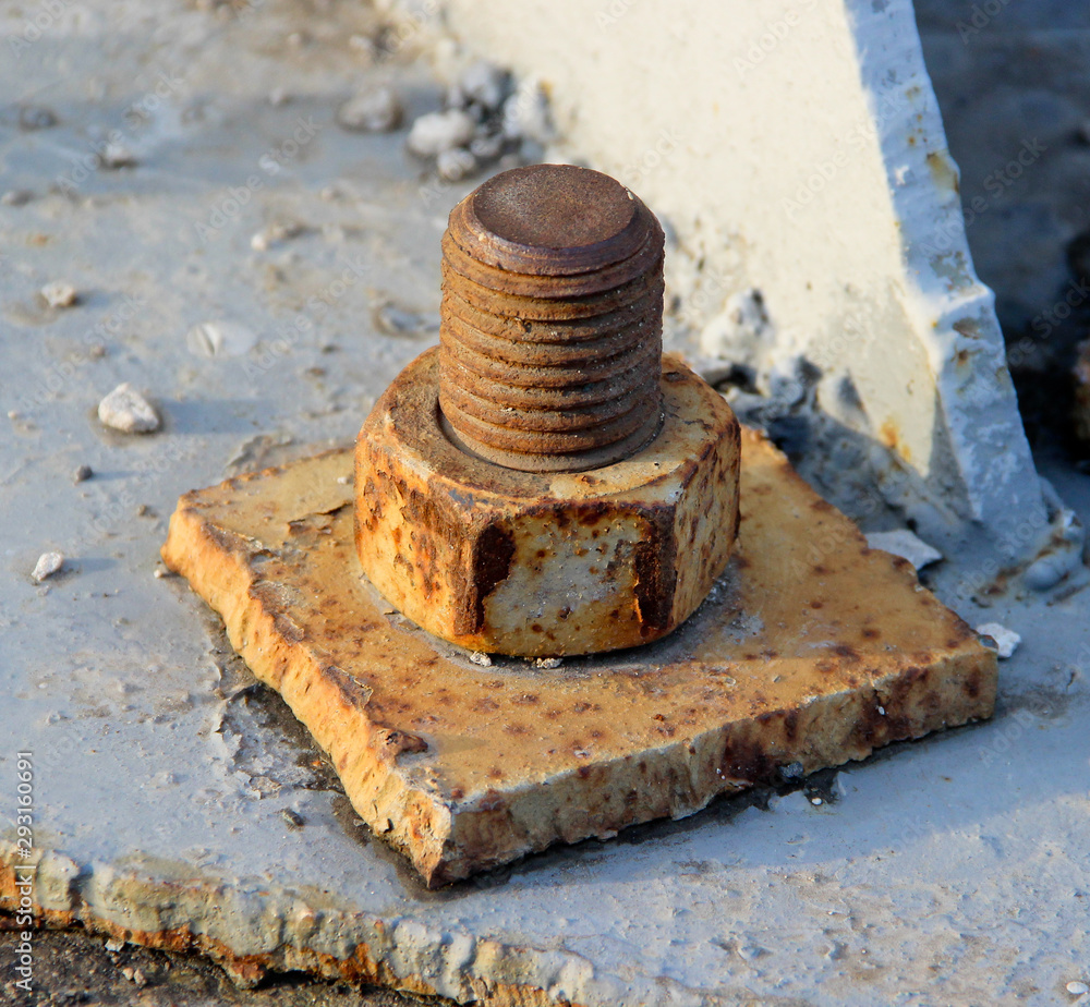 Old Rusty Bolt and Nut in a Metal Plate Old Rusty Bolt and Nut in a Metal Plate