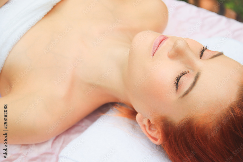 Beautiful women resting relaxing in spa resort with closed eyes. Woman lying down on massage beds outdoor at luxury spa. Beautiful women resting relaxing in spa resort with closed eyes. Woman lying down on massage beds outdoor at luxury spa.