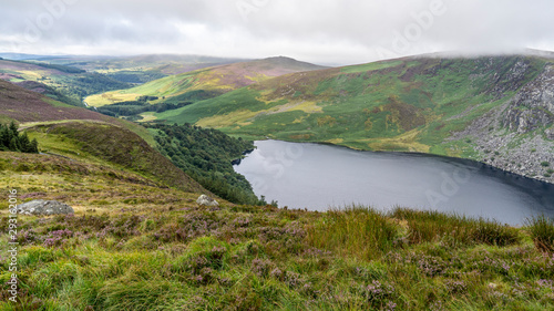 Wicklow way landscape Lough Tay Lake in a cloudy day.