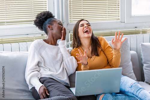 Papier peint Girlfriend watching a very funny movie on laptop