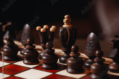 wooden chess Board with chess pieces