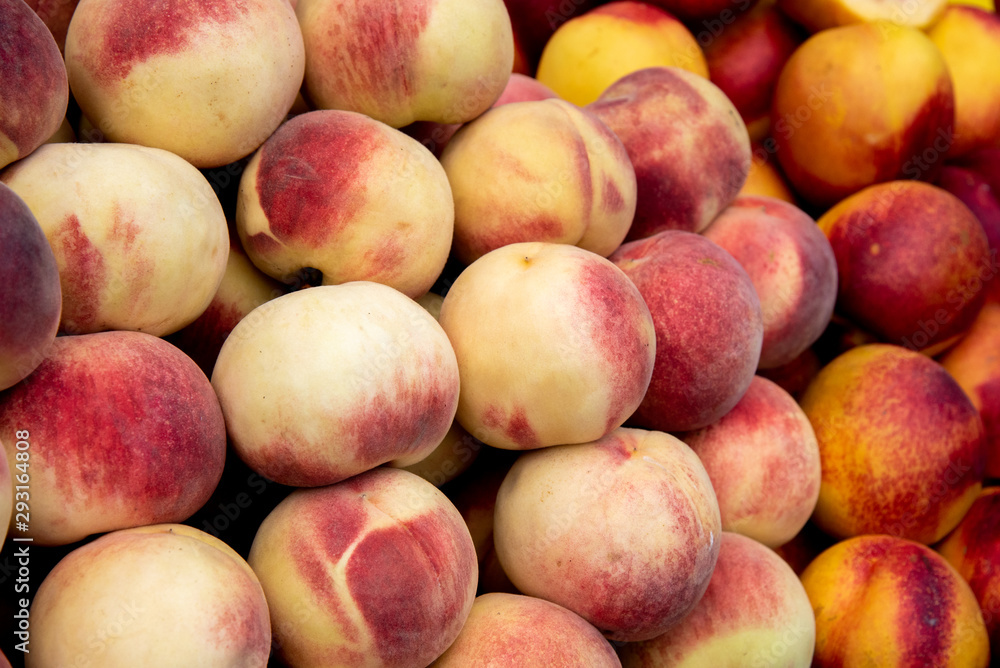 Fresh and juicy peach fruits on a fruit market Fresh and juicy peach fruits on a fruit market