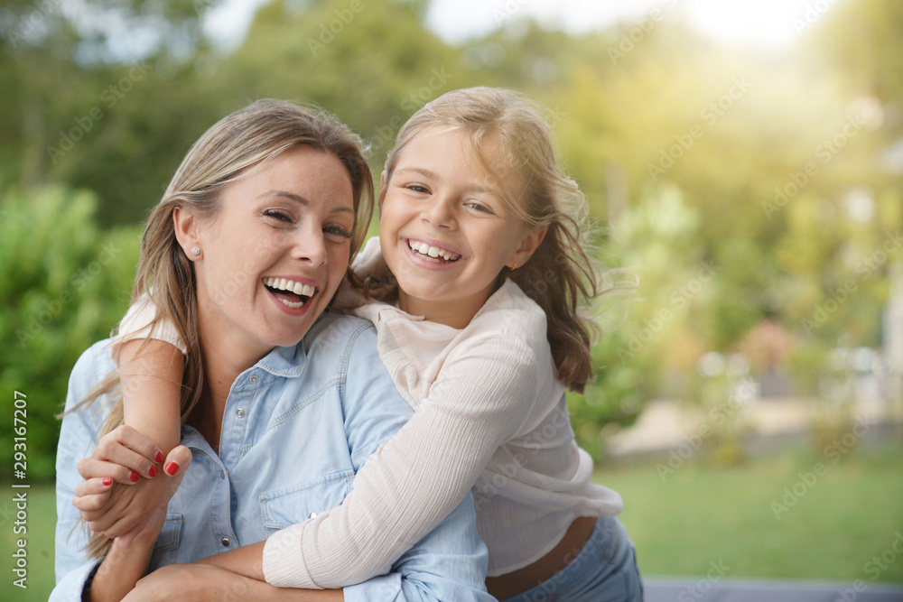 Portrait of cheerful mother and daughter Portrait of cheerful mother and daughter