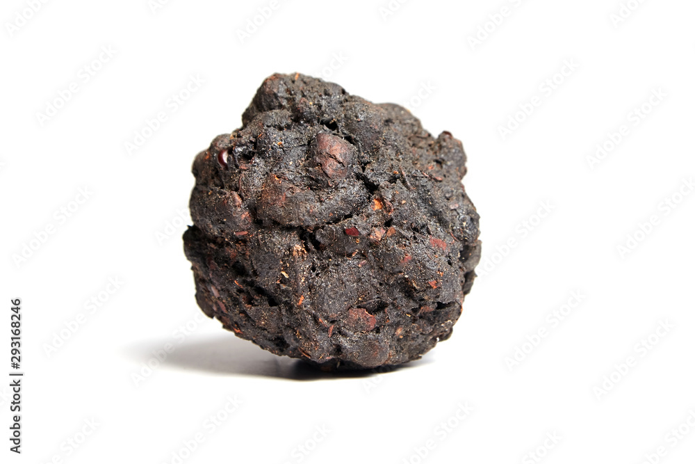 Tamarind tea (or Date Tea). Dry ball from the seeds and resins of Indian tamarind isolated on white background Tamarind tea (or Date Tea). Dry ball from the seeds and resins of Indian tamarind isolated on white background