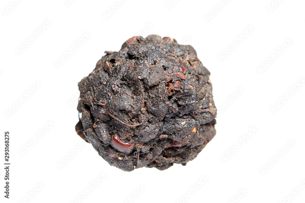Tamarind tea (or Date Tea). Dry ball from the seeds and resins of Indian tamarind isolated on white background Tamarind tea (or Date Tea). Dry ball from the seeds and resins of Indian tamarind isolated on white background