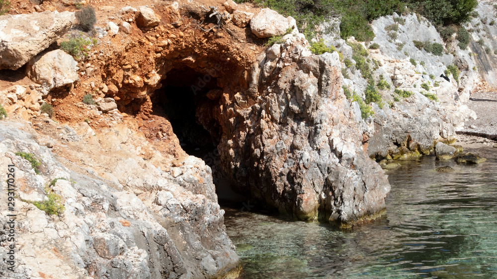 One of many fascinating caves on the rocky coast of Porto Limnionas