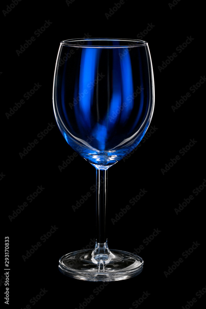 empty wine glass with blue light on black background empty wine glass with blue light on black background