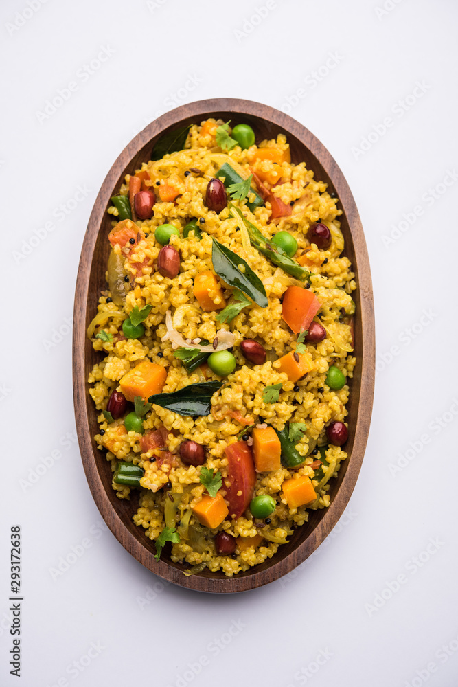 Broken wheat or Daliya Upma, served in a bowl. selective focus Broken wheat or Daliya Upma, served in a bowl. selective focus