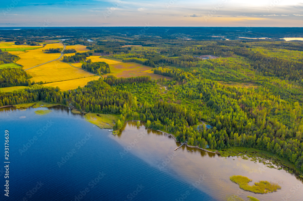 Aerial view of Pulkkilanharju Ridge, Paijanne National Park, southern part of Lake Paijanne. Landscape with drone. Blue lakes, fields and green forests from above on a sunny summer day in Finland.